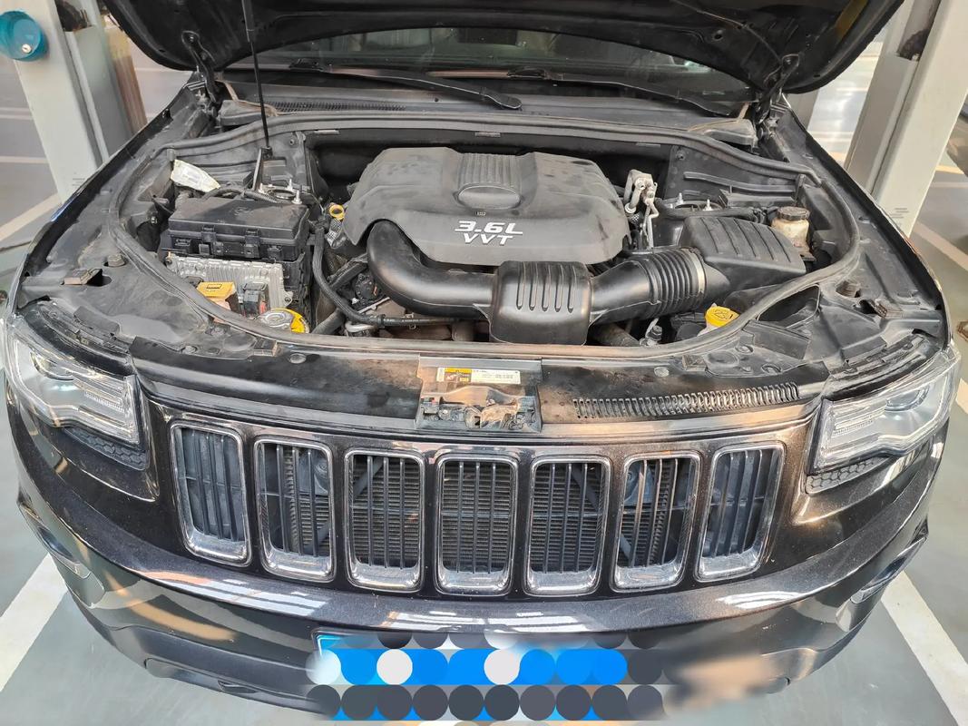 吉普大切诺基停车后前轮往下掉 切诺基2500前轮异响